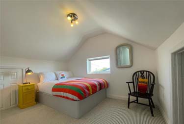 Bedroom interior view at Baywatch Mawgan Cottage in Mawgan Porth, Cornwall