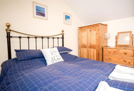 Bedroom at Honeysuckle Cottage in Mousehole, Cornwall