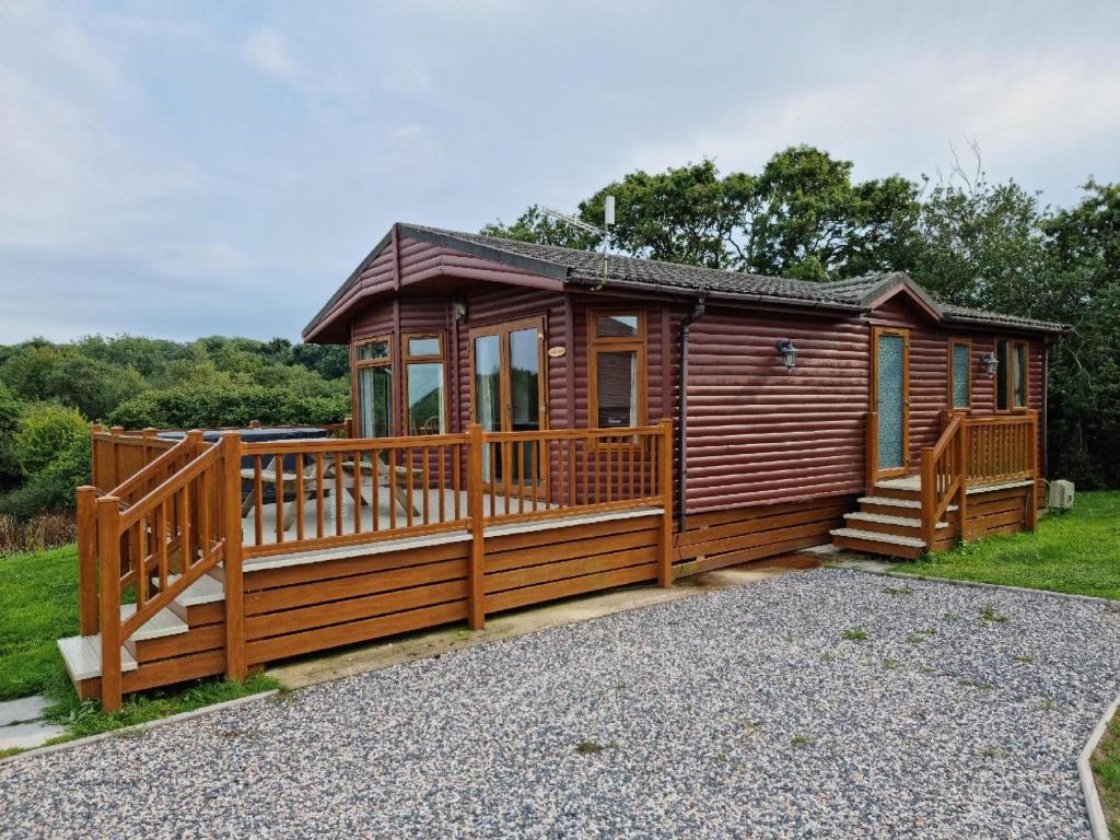 Exterior View of Willow Lodge in St Austell with Fence