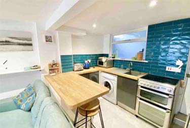 Kitchen interior view at Cornish cottage in Newlyn, Cornwall